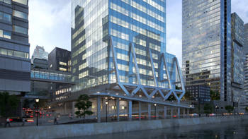 A modern, illuminated skyscraper in between other buildings